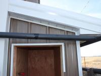 Pumphouse addition metal siding soffit fascia roofing Three Forks MT Harmon Enterprises Construction